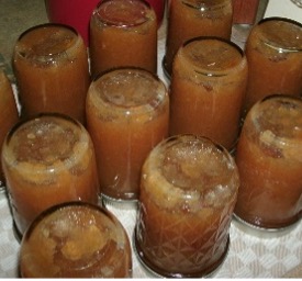 The jars of fruit butter upside down to process