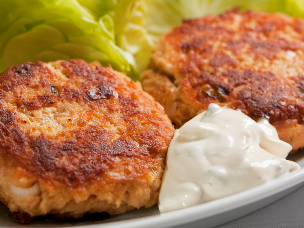The croquettes are crispy on the outside and moist on the inside, with visible chunks of salmon and herbs.