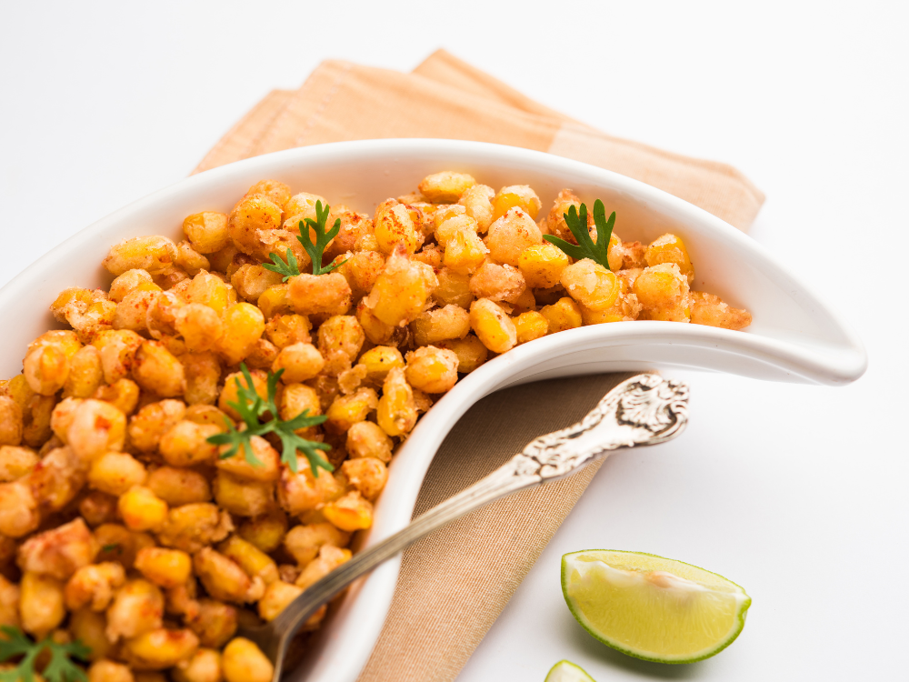 The street fried corn is spiced with a variety of seasonings, including chili powder, salt, and lime juice